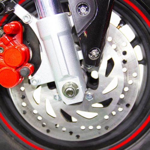 close up - wheel spokes and brake disc of a motorcycle